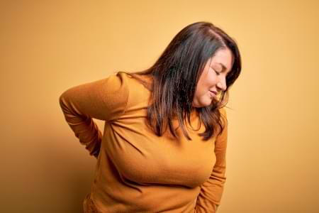 causes of lower back pain in women - breasts